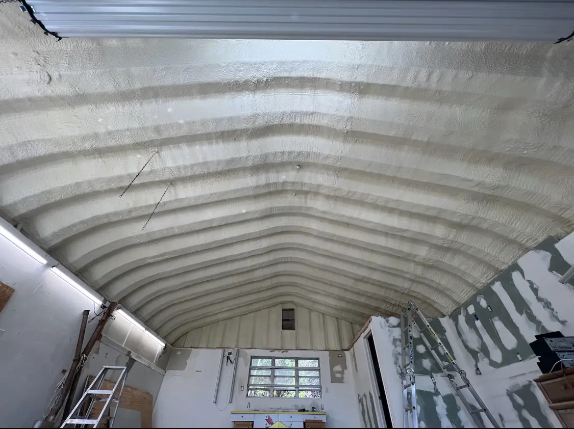 Spray polyurethane foam applied to the underside of a metal roof deck in Southold
